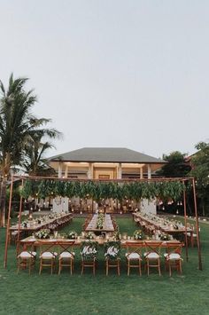 an outdoor wedding setup with tables and chairs