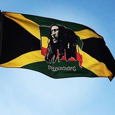 a jamaican flag with a raspberry bob marley image on the front and side