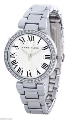 Anne Klein Women's Silver Crystal Encrusted Bezel Watch AK/1711SVSV                                               CONDITION: New with defects                                                        Watch has minor scratches on buckle only.                                                 Comes with box and papers (Box might be slightly damaged) Watch Information: Gender: Ladies Case Size: 40mm Dial Color: Silver Material Case: Metal Material Band: Metal Diamonds: n/a Movement: Analog Quartz Water Resist: 30 Meters Water Resistant Features: Hours, Minutes, Seconds   Additional Info: Packaging: Anne Klein Box & Papers   We usually ship all items in 24 hours or less. If there is a delay in dispatching your item, you will be notified  immediately. International customers - Import duties and taxe Antique Platinum Watches With Diamond Accents, Art Deco Platinum Diamond Watch In Silver, White Rectangular Quartz Watches, Timeless Diamond-accented Watch With Cubic Zirconia, Anne Klein Watch Silver, Anne Klein, Accessories Watches, Wrist Watch, Jewelry Watches