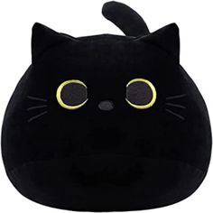 a black cat stuffed animal with big eyes and large round yellow eyes on it's face