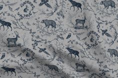 a blue and white fabric with animals on it