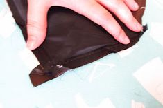 a person's hand is sticking out of an empty wallet