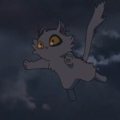 a cat flying through the air with its eyes wide open in front of dark clouds