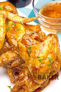 chicken wings with sauce and parsley on the side