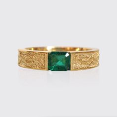 This stylish textured Emerald Dragon Ring was inspired by dragon scales. Handcrafted in 14K gold. This ring features a natural one-of-a-kind deep green emerald. Materials: 14K gold Natural 4.8x5.4mm natural emerald. Approx. 0.7ct Solid band 5mm bandwidth ** Tippy Taste Men's are made-to-order. Please allow 2-3 week turnaround time. This ring is not resizable, please ensure your ring size before ordering. Shipping:Domestic: Free standard shipping within the U.S.International: Free standard shippi Emerald Dragon, Rose Tattoos For Men, Ring Inspo, Dragon Scales, Green Stone Rings, Dragon Ring, Mens Gold Rings, Golden Ring, Gifu