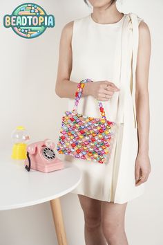 The Rainbow Heartbeat Handbag Tutorial is a step-by-step video demonstrating how to create a stylish bag. This project is ideal for beginners and all skill levels.  The required beads are heart-shaped acrylic beads. Additionally, a complete DIY kit is offered, containing all necessary beads and the video tutorial. https://www.etsy.com/listing/1710107040 The finished bag measures 7"x8.5"x1.25", perfectly sized for your cell phone, wallet, AirPods, perfume, hand cream, lipstick, card case, and other small essentials.  The kit includes materials for double strap handles with a 7" handle drop, along with extra beads for adjustments. The bag weighs approximately 1.5 pounds. Handbag Tutorial, Small Phone, Cell Phone Wallet, Cream Lipstick, Diy Kit, Phone Wallet, Stylish Bag, Acrylic Beads, Hand Cream