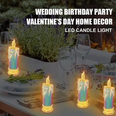 four lit candles sitting on top of a table with greenery in the background and text reading, wedding birthday party valentine's day home decor led candle