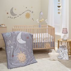 a baby's room with a crib and bedding