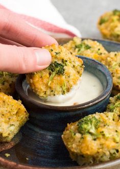 broccoli bites being dipped with ranch dressing