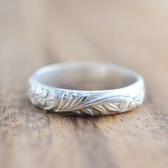 Beautiful handmade sterling silver band. Engraved floral pattern. Can be made for a man or a woman. Add an engraving to the inside of the ring: https://www.etsy.com/listing/718094264/custom-ring-engraving-inside-ring?ref=shop_home_active_2&frs=1 If you don't see your size please feel free to message me. All orders ship in a gift box. If you are ordering multiple items and want them boxed separately, please let me know in the notes at checkout. I ship via USPS. Please review the estimated del Heirloom Style Engraved Silver Bands, Heirloom Silver Engraved Bands, Heirloom Engraved Silver Bands, Silver Wedding Rings With Engraving Option, Silver Carved Engraved Ring For Anniversary, Silver Engraved Carved Ring For Anniversary, Engraved White Gold Flower Ring For Wedding, Adjustable Engraved Birthstone Ring For Wedding, Classic Carved Engraved Wedding Ring