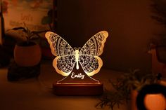 a butterfly shaped light sitting on top of a table