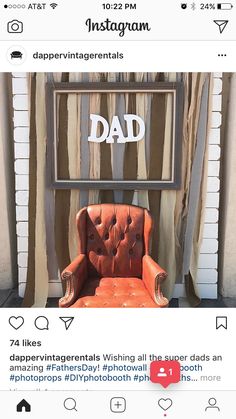 an orange chair sitting in front of a window with the word dad written on it