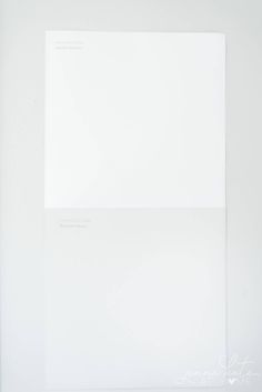 an empty white sheet of paper sitting on top of a table