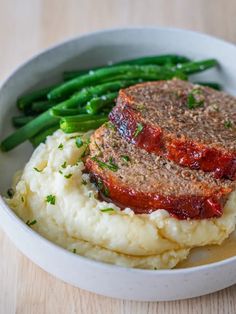 meatloaf, mashed potatoes and green beans in a bowl