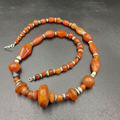 Beautiful Ancient Indo-Tibetan Carnelian And Banded Agate Beads Necklace. The Age Of This Beads More Than 1000 Years From Ancient Himalayan Cultures Civilizations. The Carnelian Beads Got Very Beautiful Color And Very Smooth Skin Its Because Of Long Passage Of Time Using. Conditions Of Beads As Shown In The Pictures. Quite Long String Necklace Many Beads In The Strings. Traditional Carnelian Necklace With Polished Beads, Bohemian Carnelian Round Bead Necklace, Traditional Amber Carnelian Necklace, Artisan Carnelian Beads In Amber Color, Artisan Carnelian Amber Beads, Traditional Carnelian Beads For Jewelry Making, Bohemian Carnelian Beads For Jewelry Making, Traditional Polished Carnelian Beads And Cabochons, Bohemian Carnelian Beads With Natural Stones