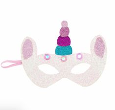 Stock your costume closet with our Kid's Unicorn Mask. The mask features fun glitter felt fabric. The mask also features LED light-up. The mask works with included batteries. Add this mask to your head with the elastic strap. This mask is intended for children ages three and older. Material Felt UPC Code 718540814284 Costume Closet, Light Up Dresses, Unicorn Light, Unicorn Mask, Mask Style, Halloween Toys, Wind-up Toys, Halloween Lights, Felt Material