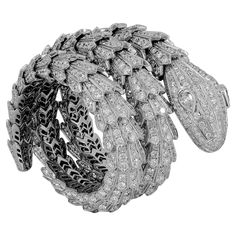 For Sale on 1stDibs - A magnificent 18k white gold Serpenti bracelet that captures the power and essence of seduction through the iconic Bulgari serpent, which sensually coils Diamond Scale, Vintage Diamond Earrings, Sparkly Bracelets, 18k Gold Bracelet, Gold Bracelet Set, Antique Bracelets, Victorian Vintage, Diamond Bangles Bracelet