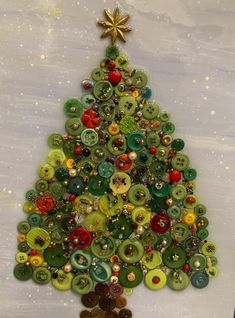 a christmas tree made out of buttons on a table