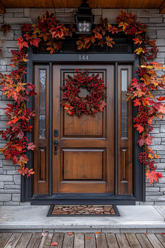 the front door is decorated with autumn leaves and wreaths on it's sides