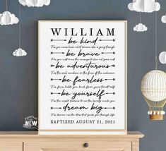 a framed poster with the words william and elizabeth on it, hanging above a dresser