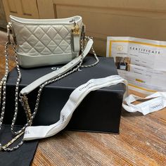 Chanel Silver Goatskin Quilted Gabrielle Small Hobo Perfect Day To Day Bag, Evening Bag Or Collector This Bag Is In Great Condition, With Minor Wear On The Exterior Hardware. The Interior Is In Gently Used Condition With A Few Marks On The Interior Bottom.(See Photos) Serial 28775264 This Bag Includes -> Entrupy 100% Authentic Certificate Buy With Confidence Chanel Box Chanel Dustcover 16116/Hccc Grey Chanel Classic Flap, Chanel Silver Bag, Chanel Metallic Bag, Chanel Metallic Silver Bag, Leather Button Up, Chanel 2019, Grey Shoulder Bag, Gucci Mini, Chanel Box