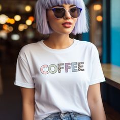 Perfect for the coffee lover in your life! The unisex soft-style t-shirt puts a new spin on casual comfort. Made from very soft materials, this tee is 100% cotton for solid colors. Heather colors and sports grey include polyester. The shoulders have twill tape for improved durability. There are no side seams. The collar is made with ribbed knitting to prevent curling damage.  The perfect gift for her! HOW TO ORDER Choose the color and size you want. Click the Add to Cart button. You can go back Trendy Coffee Crew Neck Tops, Trendy Coffee Short Sleeve Tops, Trendy Coffee Color Short Sleeve Tops, Trendy Coffee Colored Relaxed Fit T-shirt, Trendy Coffee-colored T-shirt With Screen Print, Trendy Coffee-colored Screen Print T-shirt, Trendy Coffee Color T-shirt With Screen Print, Trendy Coffee Colored Crew Neck T-shirt, Trendy Coffee Cotton T-shirt