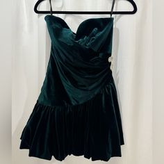 Strapless Velvet Cocktail Dress With Sweetheart Neckline. Dress Has Rushing Detail With Crystal Button Accents. Condition: New With Tags Color: Deep Emerald Green Coquette Mini Dress With Sweetheart Neckline For Date Night, Coquette Strapless Mini Dress For Night Out, Vintage Mini Length Corset Dress For Party, Strapless Coquette Mini Dress For Evening, Chic Strapless Dresses With Buttons, Fitted Dress With Buttons And Sweetheart Neckline, Green Vintage Mini Dress For Party, Vintage Mini Dress For Night Out, Vintage Sleeveless Mini Dress For Date Night