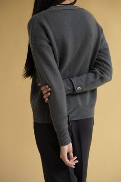 A new take on our cashmere cardigan sweater. 100% Grade A Mongolian cashmere in an oversized boyfriend fit. Features button front & adjustable button sleeve closure. DETAILS FIT: Model is 5'9" and is wearing a size S. FABRIC: 100% cashmere CARE: Hand wash cold with like colors. Lay flat to dry, low iron if needed. Sweater can be washed in a washing machine on delicate style. Lat Flat to dry or machine dry on gentle cycle. Hand washing cashmere can lead to a longer lifecycle. Everyday Button-up Cashmere Sweater, Fall Button-up Polo Sweater With Button Cuffs, Fall Polo Sweater With Button Cuffs For Work, Fall Workwear Polo Sweater With Button Cuffs, Cashmere Polo Sweater For Work With Button Closure, Fall Cashmere Sweater With Button Cuffs, Winter Cashmere Sweater With Button Closure, Casual Cashmere Sweater With Button Cuffs, Relaxed Fit Sweater With Button Cuffs For Fall