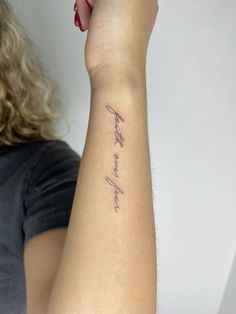 a woman with a tattoo on her arm