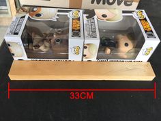 the box is open and has three different figurines in it