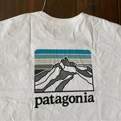 New With Tag Patagonia Men’s White Short Sleeve T-Shirt Size Xl And Xxl Measurements And Pictures Shown Xl Only Cotton N Polyester Blend Patagonia Logo On The Front Pocket And Back Please See All The Pictures For Details And Measurements. Stored In A Pet And Smoke Free Place. Casual White T-shirt For Hiking, Casual Patagonia Tops With Graphic Print, Patagonia Hoodie, Patagonia Sweatshirt, Patagonia Logo, Mens White Shorts, Patagonia Long Sleeve, Patagonia Shirts, Button Up Shirt Mens