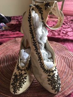 "These fabulous antique silk beaded wedding shoes are the most unique examples of footwear from the latter part of the 1800s. They are crafted with luscious silk uppers adorned with teeny copper-colored beaded designs. They also have beaded silk ankle straps that close with matching covered buttons. The numbers 37 and 4 are stamped on the soles and some writing in ink that includes \"1865\". These lovely works of art are in great condition for their 130+ years with only a couple of small splits, Beaded Flapper Dress, Beaded Designs, Satin Wedding Gown, Dog Bones, Wedding Shawl, Beaded Wedding, Silk Wedding, Womens Wedding Shoes, Satin Wedding