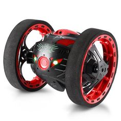 a red and black toy car with wheels on it's sides, in front of a white background