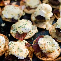 an assortment of appetizers with bacon and cheese on them are shown in this close up photo