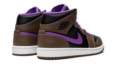 The Air Jordan 1 Mid “Palomino” is a unique colorway of the popular sneaker that features a neutral-colored design, but with a twist.  The “Palomino” is complete with a black leather base that gives way to brown leather overlays throughout.  A Wild Berry leather Swoosh appears on either side of the shoe.  The purple hue reappears on the Jumpman and “Air” branding on the tongue, on the interior of the sneaker, and on the laces.  Classic black “Wings” branding is found on the collar.  Underfoot, a Modern Brown High-top Sneakers For Streetwear, Modern Brown Custom Sneakers For Streetwear, Brown Jordan Shoes With Boost Midsole For Streetwear, Casual Brown Jordan Shoes With Boost Midsole, Brown Jordan Shoes With Rubber Sole For Streetwear, Brown Jordan Sports Shoes With Rubber Sole, Brown Mid-top Custom Sneakers With Cushioned Footbed, Casual Brown Basketball Shoes With Abzorb Midsole, Brown Custom Sneakers With Abzorb Midsole For Sports