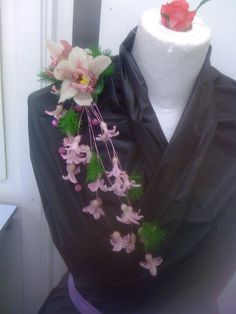 a white mannequin with flowers on it