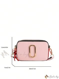 a pink purse with a gold metal d on the front, and measurements for it