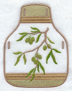 an embroidered image of a jar with green leaves and olives on the inside,