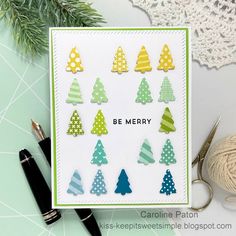 a card with christmas trees and the words be merry