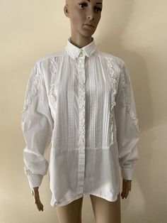 This is a lovely vintage folk style white blouse  Shoulders 44cm Pit to pit 55 Sleeve length 42 Length 65 Size L White Broderie Anglaise Blouse For Work, Elegant White Shirt With Broderie Anglaise, Classic White Blouse With Broderie Anglaise, White Bohemian Shirt For Daywear, Classic White Broderie Anglaise Blouse, White Cottagecore Blouse For Fall, Classic White Shirt With Lace Trim, White Folk Blouse For Summer, White Bohemian Daywear Shirt