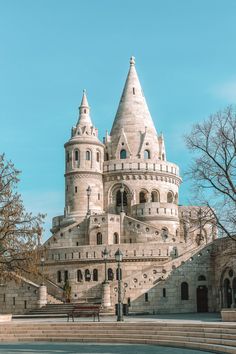 a large castle like building with stairs leading up to it's top and bottom