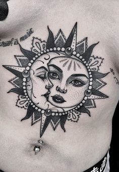 a chest with a sun and moon tattoo design on it's side ribcage