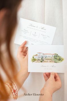 a woman holding up an envelope with a wedding card in front of her and the bride's name on it