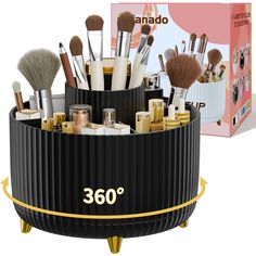 the makeup brush holder is black with gold trimmings and has 360 degree view