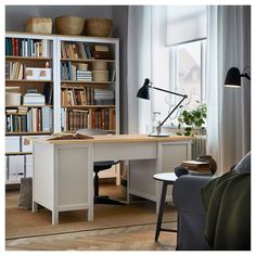 a home office with bookshelves, desk and chair