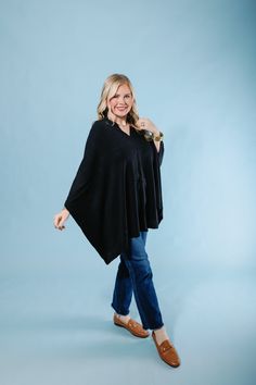 Our Lightweight Poncho is the perfect addition to any wardrobe. It's made of soft, lightweight fabric perfect for layering. It can be worn year-round and is a must-have for work, travel, or on-the-go. This versatile poncho can be worn multiple ways including a scarf, poncho, cape and more. Pair with our Embrace Fashion Fasteners to create a unique look. Casual One-size Poncho For Layering, Casual Long Sleeve Cape For Layering, Versatile Fall Poncho, Black Spring Poncho For Layering, Black Poncho For Spring Layering, Black Spring Poncho, Oversized Casual Poncho For Layering, Casual Solid Color Poncho For Fall, Casual Black Poncho For Layering