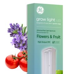 the grow light is next to some flowers and fruit in front of an open box