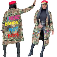 two women dressed in camouflage clothing and hats, one is pointing at the other with her hand