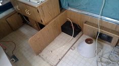 a small bathroom with a sink, toilet and other items in the area that is under construction