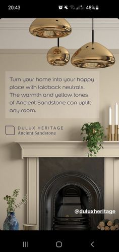 a living room with a fireplace and two lights above the fire place in front of a sign that says, turn your home into our happy place